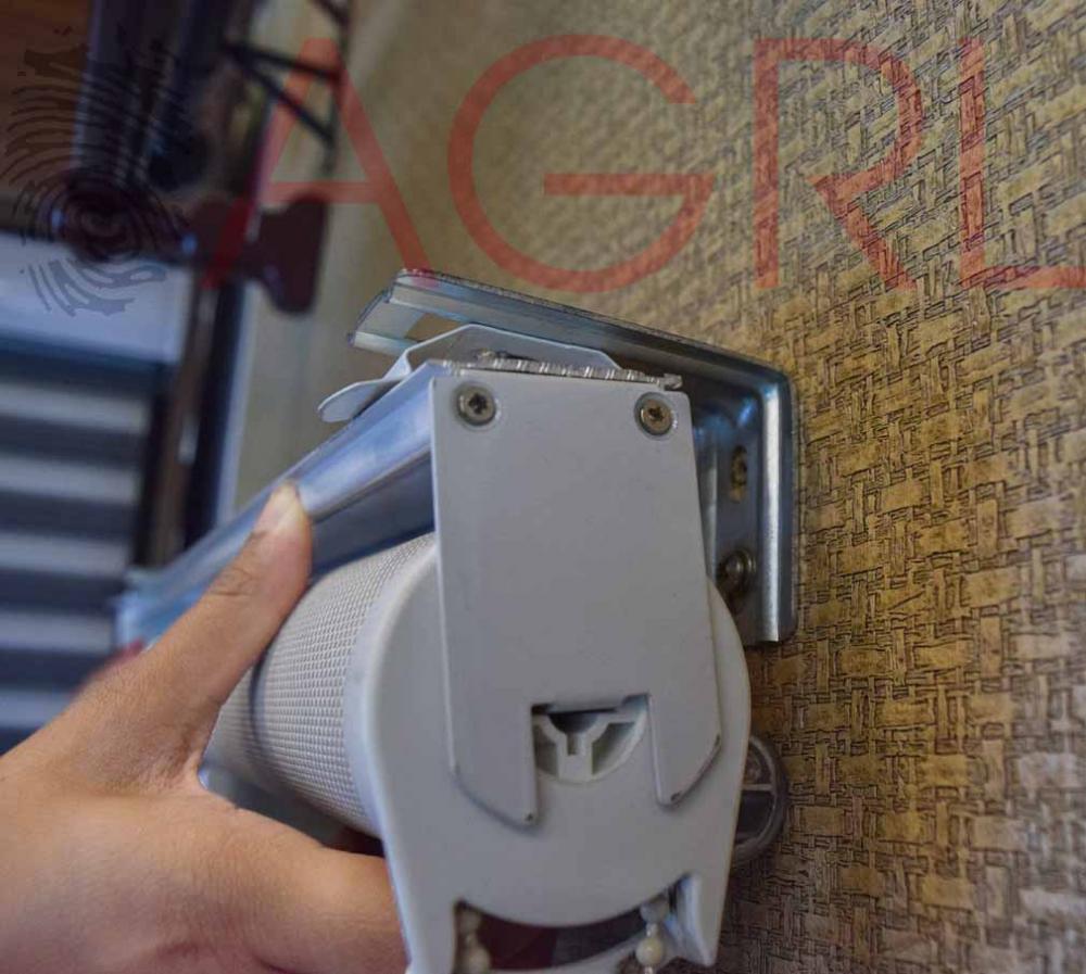 Using a pencil, mark the holes on each bracket for mounting the nails.