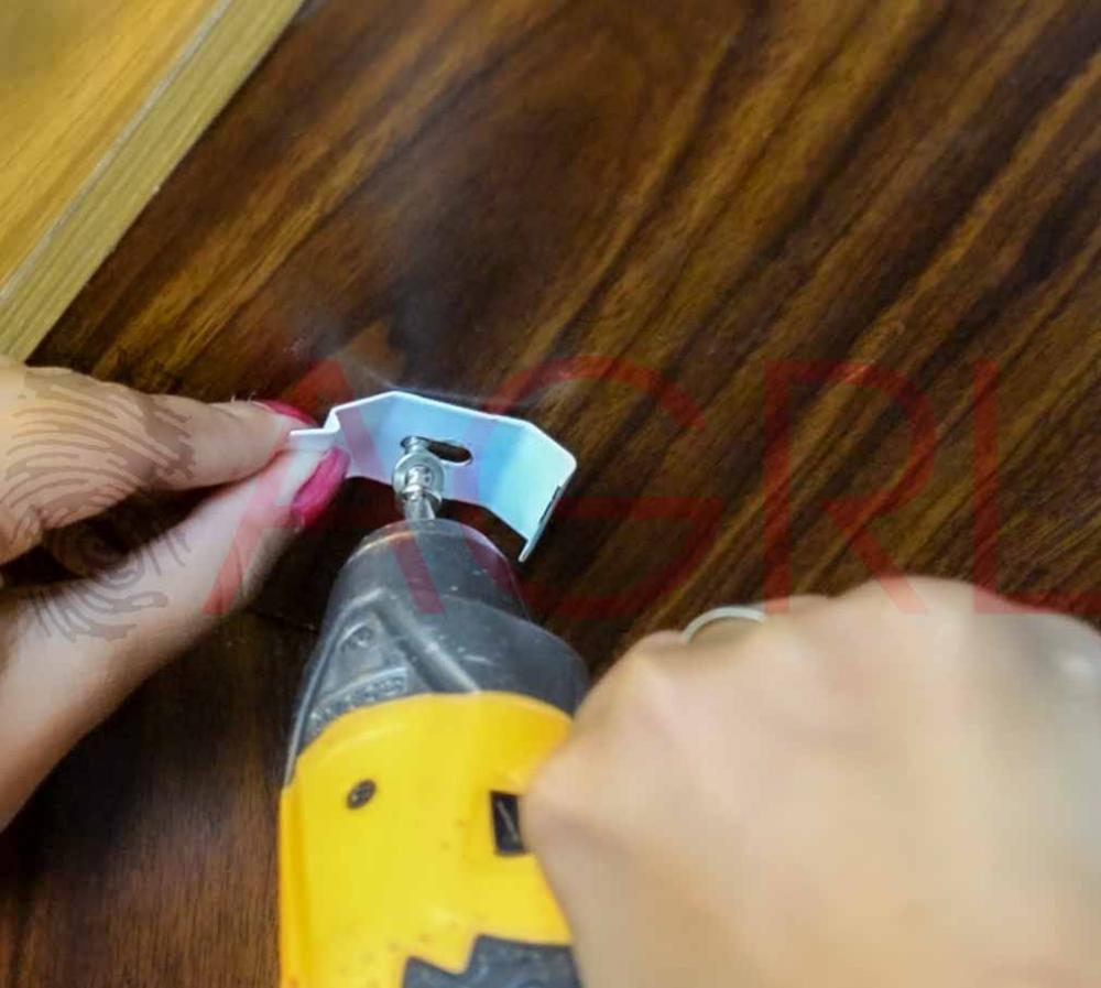 Using a pencil, mark the holes on each bracket for mounting the nails.