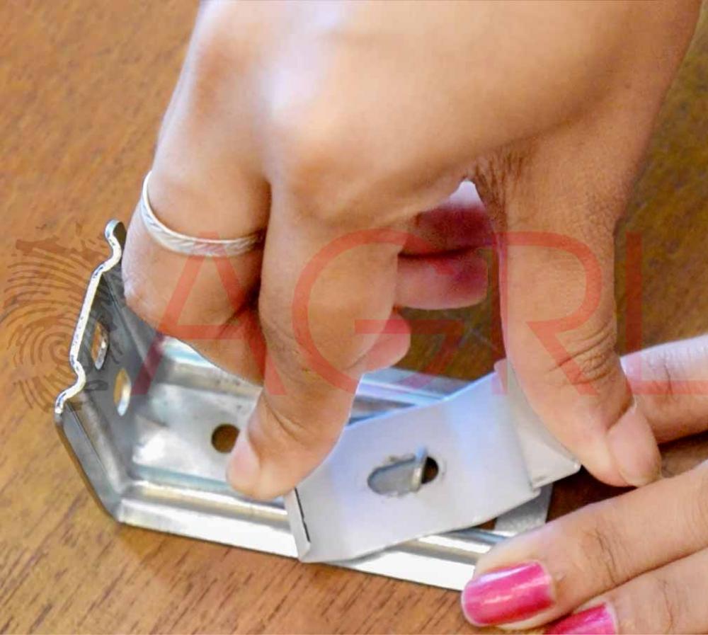 Using a pencil, mark the holes on each bracket for mounting the nails.